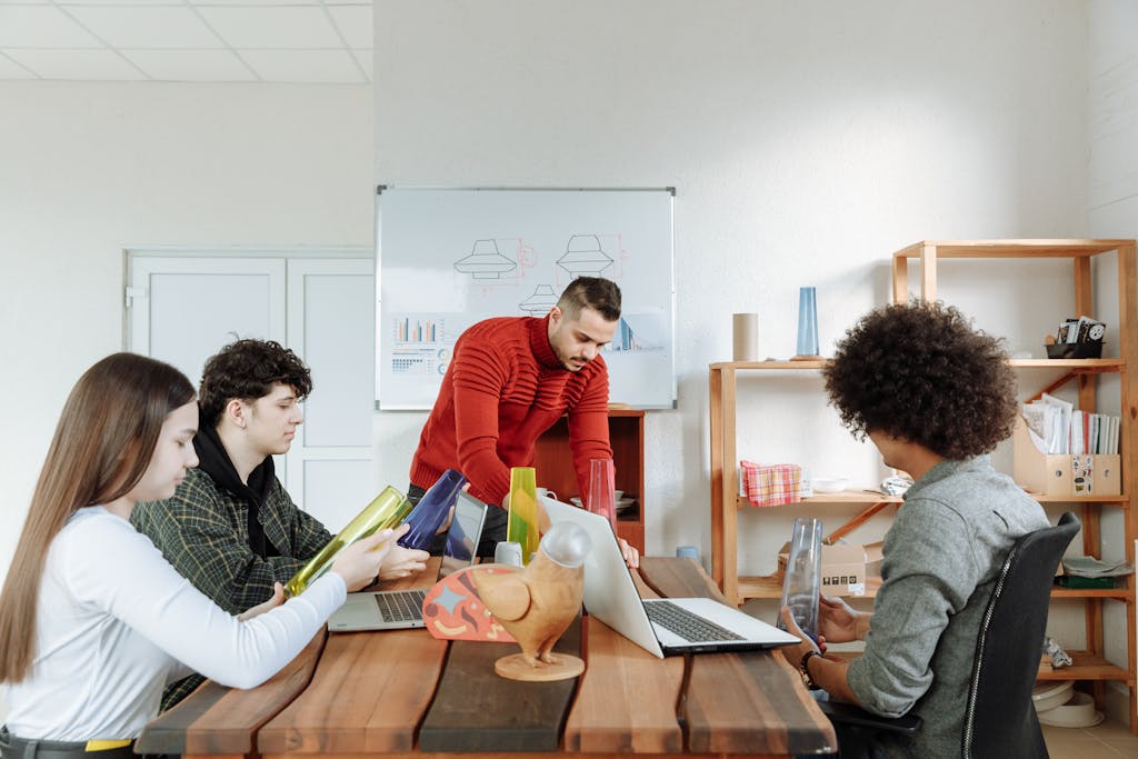 A diverse team brainstorming in a modern office, focusing on creativity and collaboration.